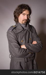 young man dressed as russian military, studio picture