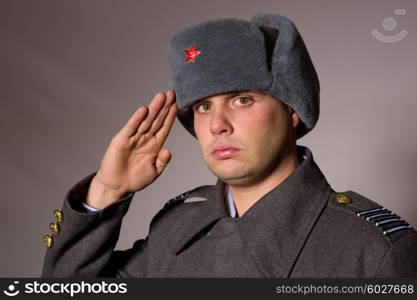 young man dressed as russian military, studio picture