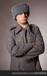 young man dressed as russian military, studio picture