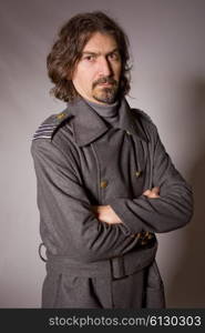 young man dressed as russian military, studio picture