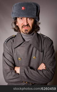 young man dressed as russian military, studio picture