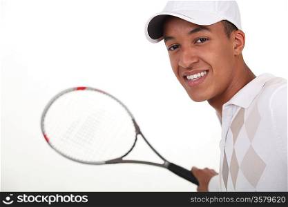 Young man dressed for tennis