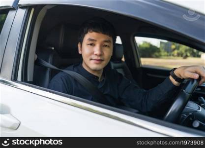 young man driving a car
