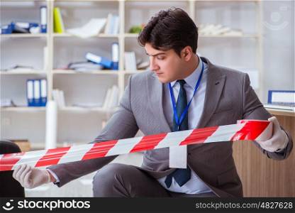 Young man during crime investigation in office