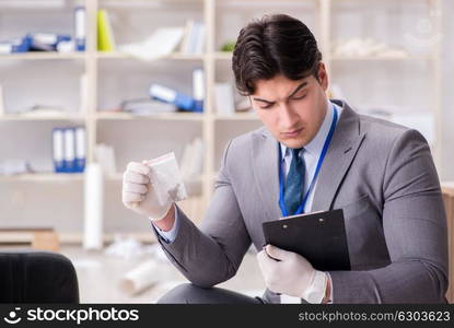 Young man during crime investigation in office