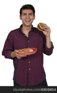 Young man eating a juicy delicious hamburger