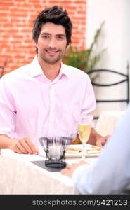 Young man eating in a restaurant