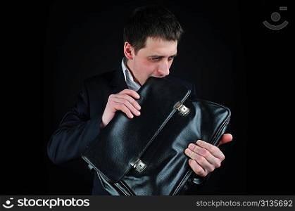 young man eating suitcase