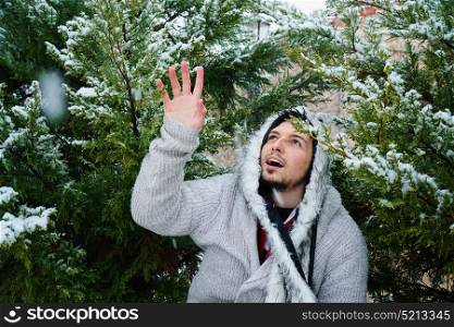 Young man enjoying a winter snowy day