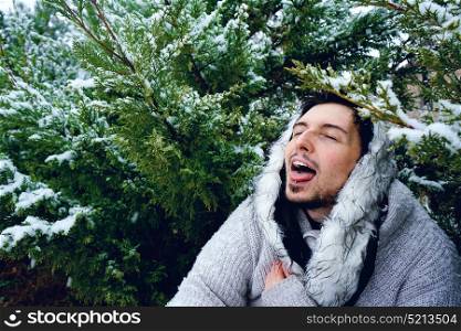 Young man enjoying a winter snowy day