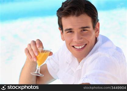 young man enjoying an orange juice