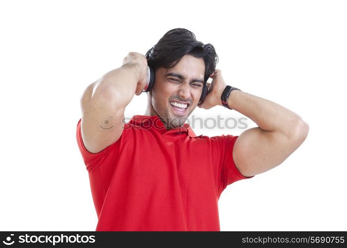 Young man enjoying while listening to music