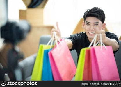 Young man freelancer working sme business online shopping at home - Business online shipping and delivery concept