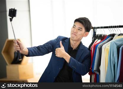 Young man freelancer working sme business online shopping at home - Business online shipping and delivery concept