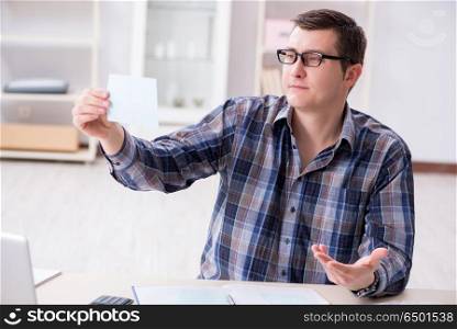 Young man frustrated at his house and tax bills