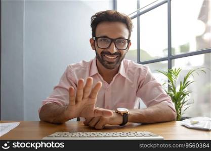 Young man gesturing while talking on a video call