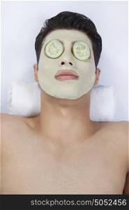 Young man getting a facial
