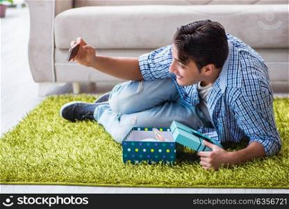 Young man getting rabbit as birthday present