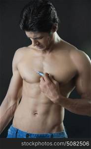 Young man giving himself an injection