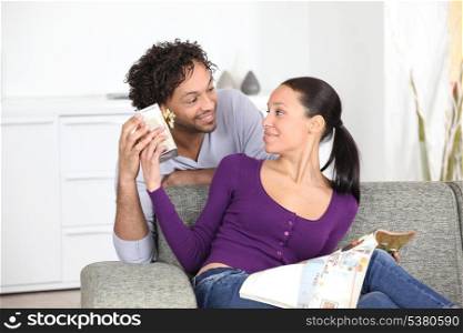 young man giving present to girlfriend