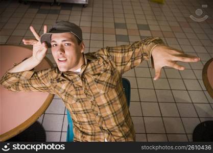 Young man hanging out in mall food court