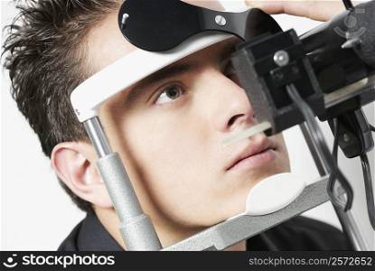 Young man having an eye test