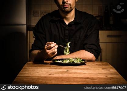Young man having dinner