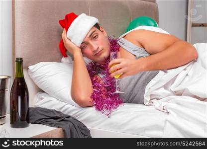 Young man having hangover after heavy partying