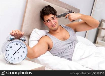 Young man having trouble waking up in the morning