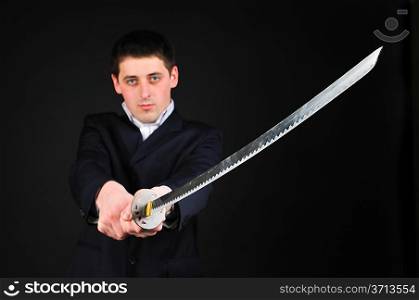 Young man hold sword