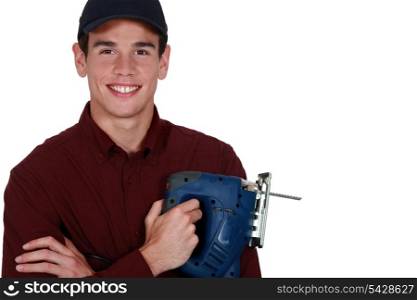 Young man holding a jigsaw