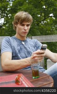 Young man holding a mobile phone