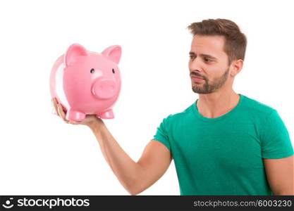 Young man holding a piggy-bank - money concept