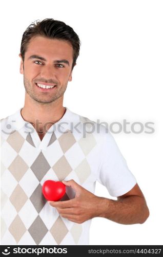 Young man holding red heart