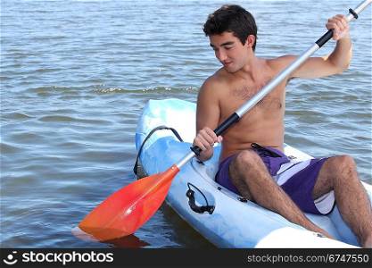 Young man in a canoe
