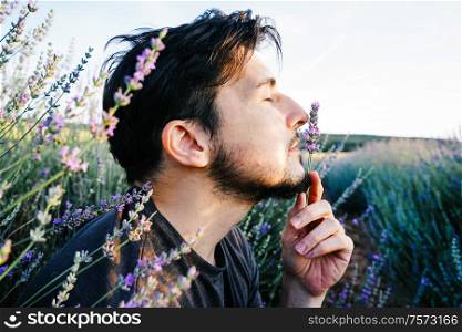Young man in a field of flowers, a tale of a new masculinity