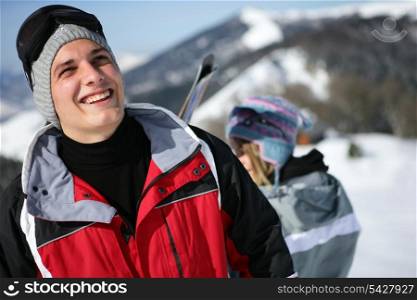 Young man in a red ski jacket