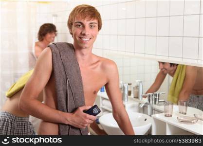 Young man in a shared bathroom