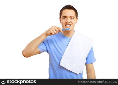 Young man in blue shirt brushing his teeth