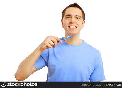 Young man in blue shirt brushing his teeth