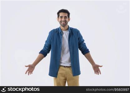Young man in casual outfit looking at the camera with smile