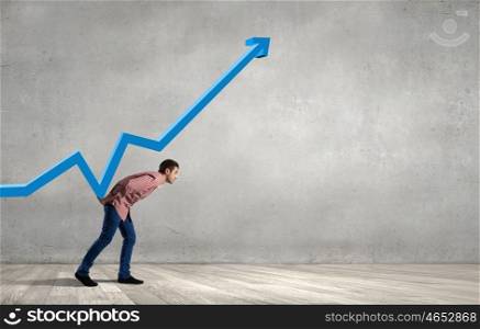 Young man in casual supporting increasing graph