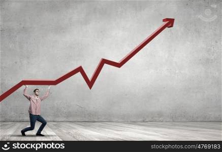 Young man in casual supporting increasing graph