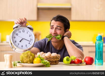 Young man in dieting and healthy eating concept