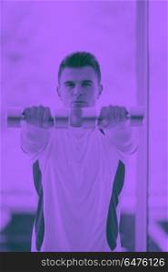 young man in fintess sport club exercise with weights and relaxing duo tone. man exercise with weights