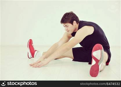 young man in fintess sport club exercise withweights and relaxing. man fitness workout