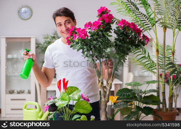 Young man in gardening concept at home