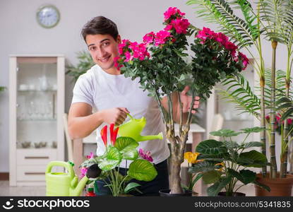 Young man in gardening concept at home