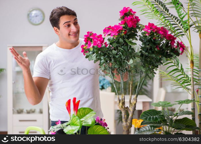 Young man in gardening concept at home