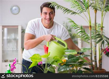 Young man in gardening concept at home
